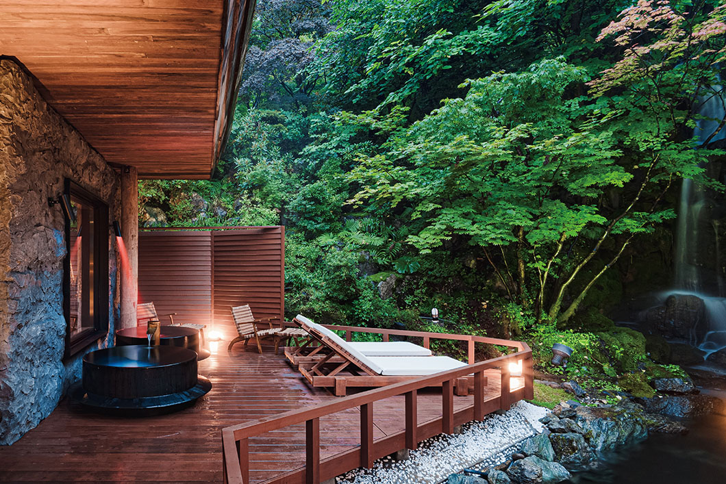 Photo: Outdoor bathing space on a wooden deck.